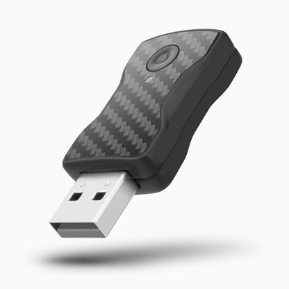 Compact wireless car adapter dongle on white background