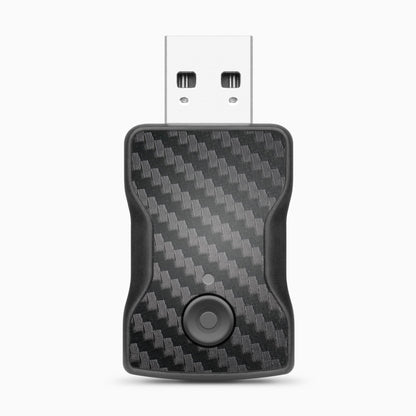 Compact wireless car adapter dongle on white background